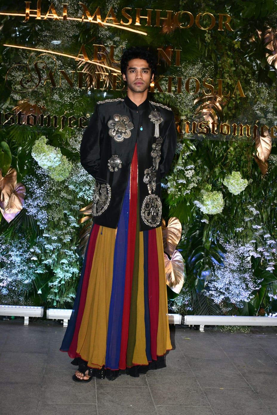 Bollywood actor Babil Khan made an entrance with a black leather jacket with flashy embroidered silver details, paired with a muted multi-colour anarkali kurta, styled as a skirt for a camp moment.